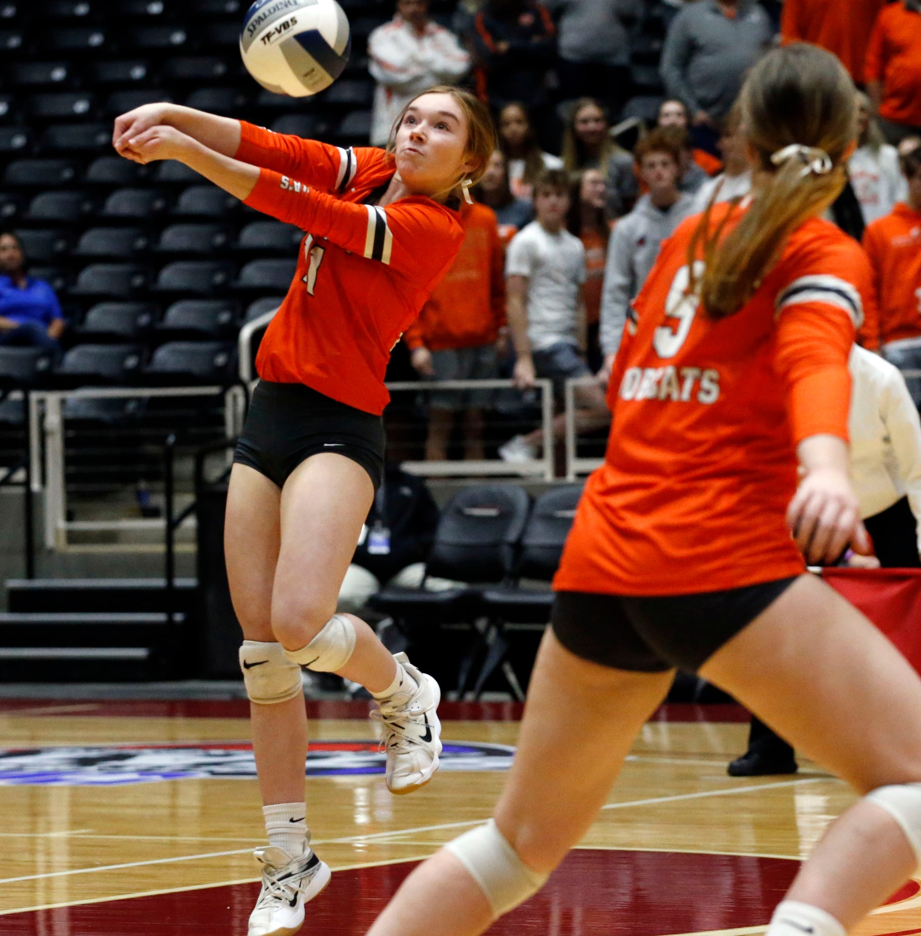 Celina's Kinsey Murray (11) sets a shot during the Class 4A state semifinal volleyball match...