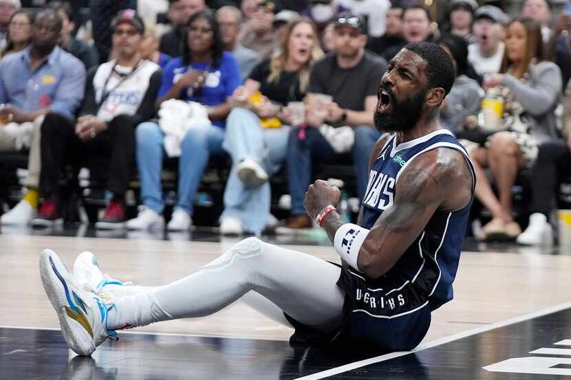 Dallas Mavericks guard Kyrie Irving celebrates after scoring during the second half in Game...