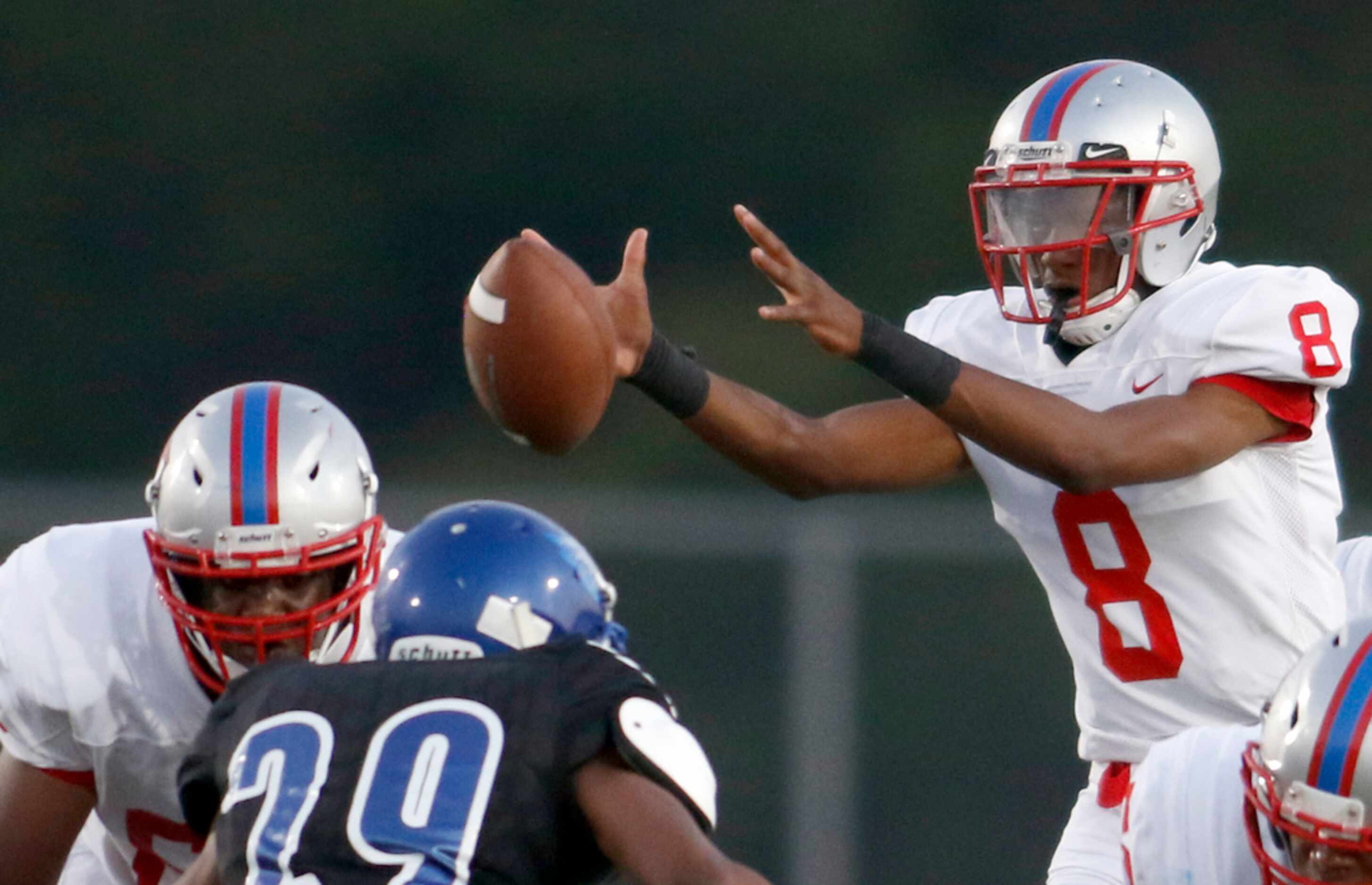 Spruce quarterback Damethis Davis (8) reaches to pull in a wide snap during first half...