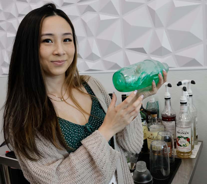 Shot Tea co-owner Mimi Vu makes Berry Mojito at her shop.