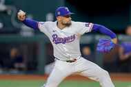 Texas Rangers starting pitcher Nathan Eovaldi delivers during the first inning of a baseball...