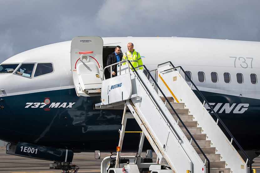 In this April 3, 2019, image courtesy of Boeing, Dennis Muilenburg (front), CEO of Boeing,...