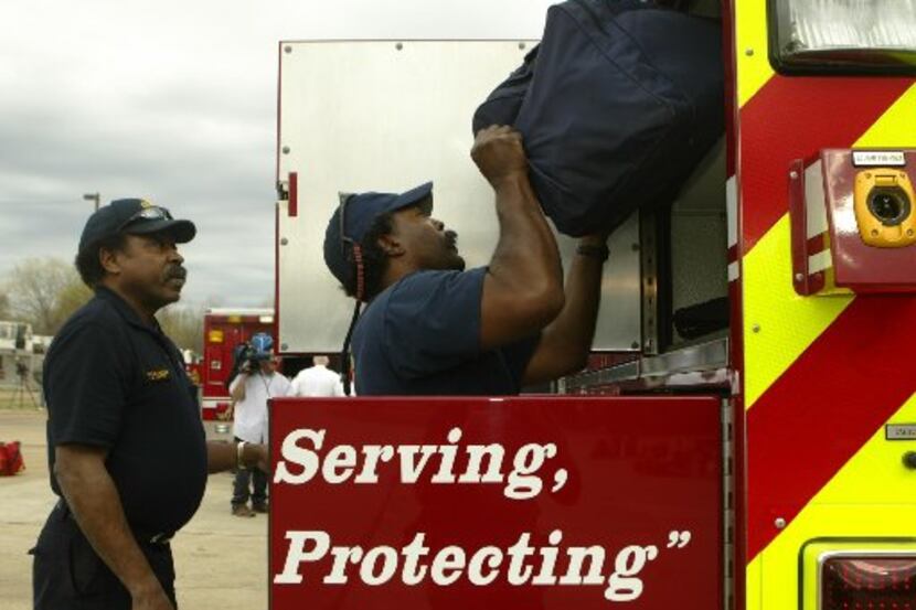 J.V. Smith (left) and Marcus Evans prepared to head to help fight grass fires in Childress...