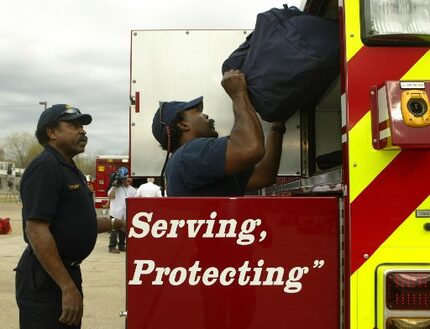 J.V. Smith (left) and Marcus Evans prepared to head to help fight grass fires in Childress...