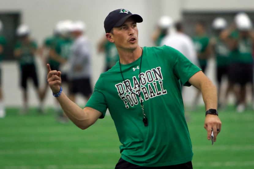 Southlake Carroll dragons head coach Riley Dodge directs his players through opening day...