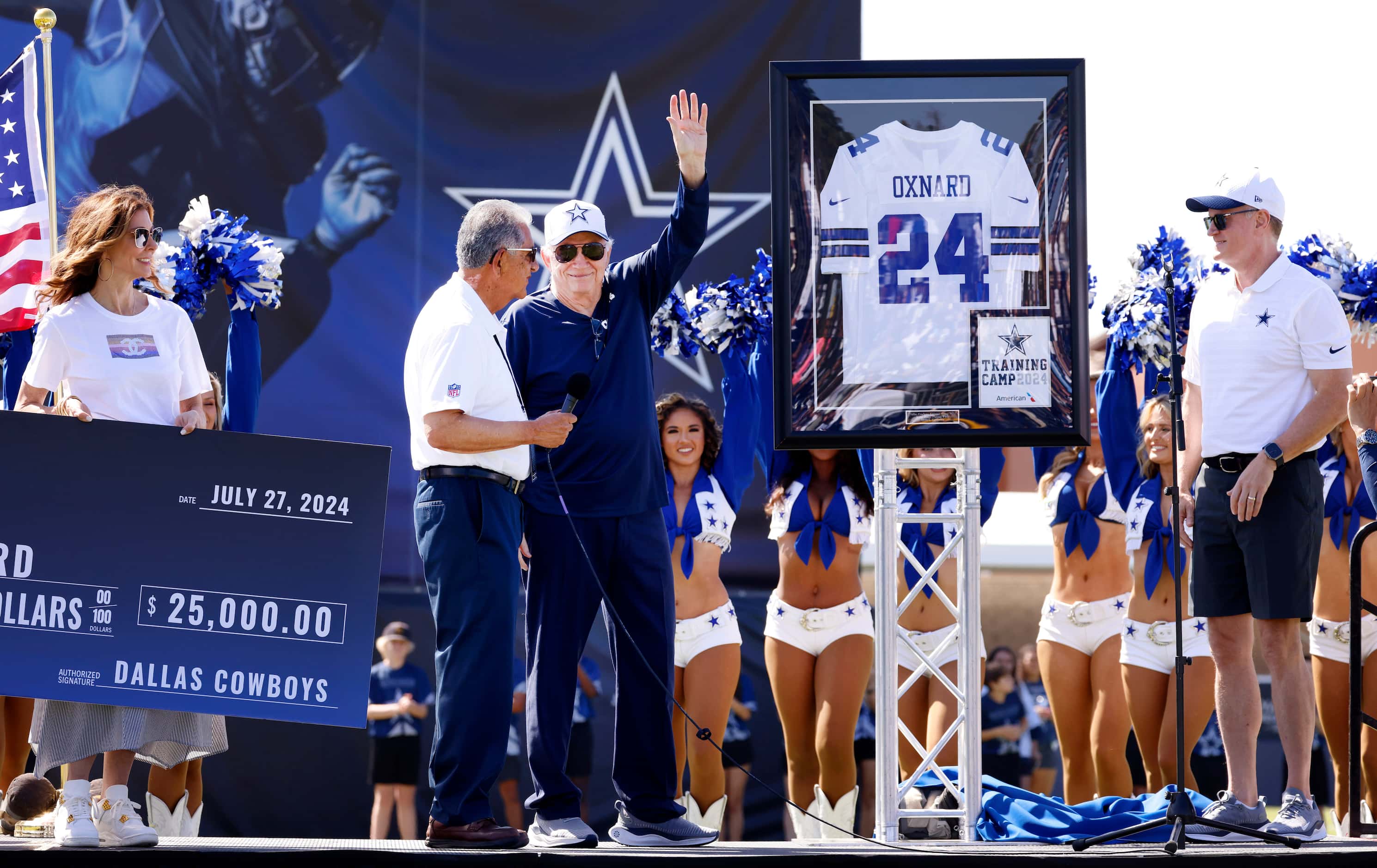 Dallas Cowboys owner Jerry Jones waves to fans after gifting a frame 24 jersey to Oxnard...