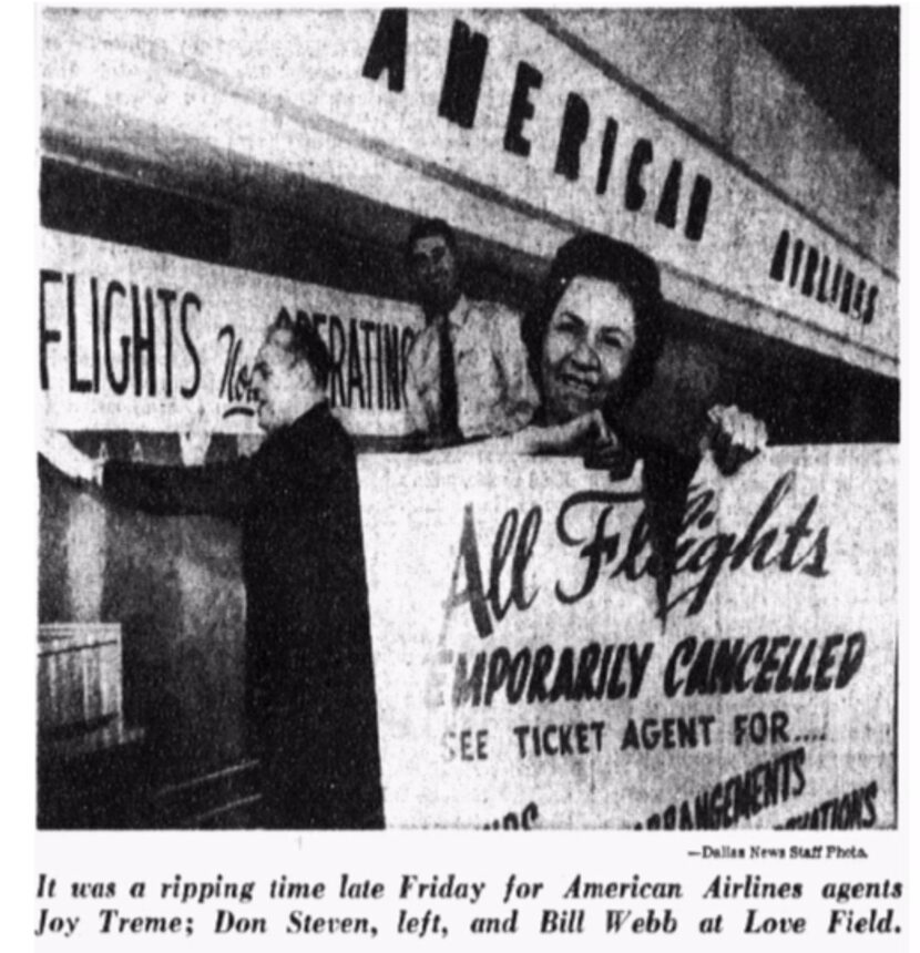 Ticket agents celebrate the end of the strike by tearing down signs.