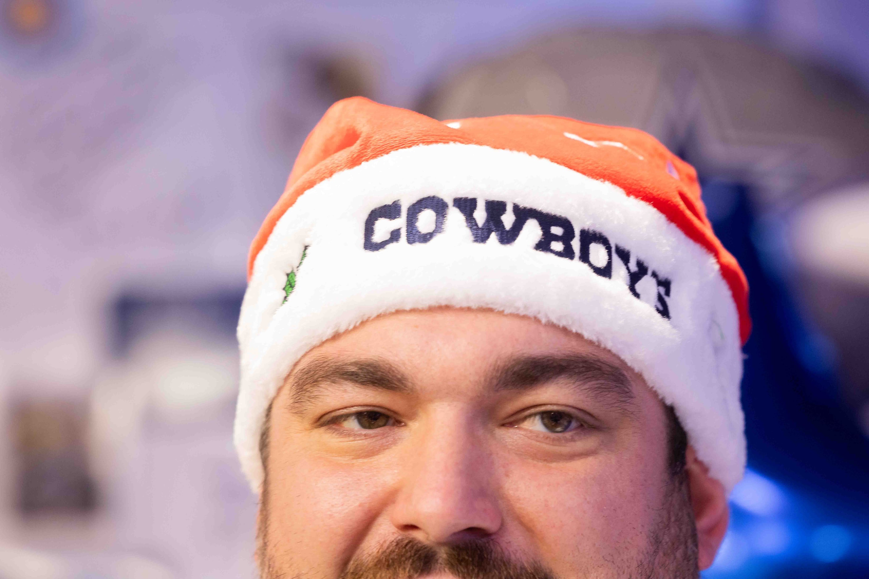 Dallas Cowboys guard Zack Martin (70) wears a Cowboys Santa hat as he talks to the press at...