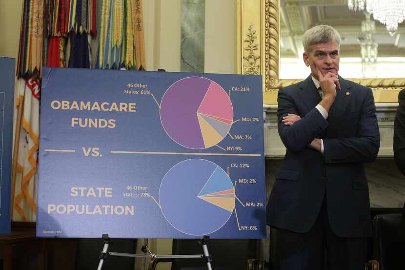 U.S. Sen. Bill Cassidy listens during a news conference on health care Sept. 13, 2017 on...
