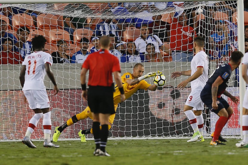 Milan Borjan #18 of Canada makes a save against Costa Rica in the second half at BBVA...