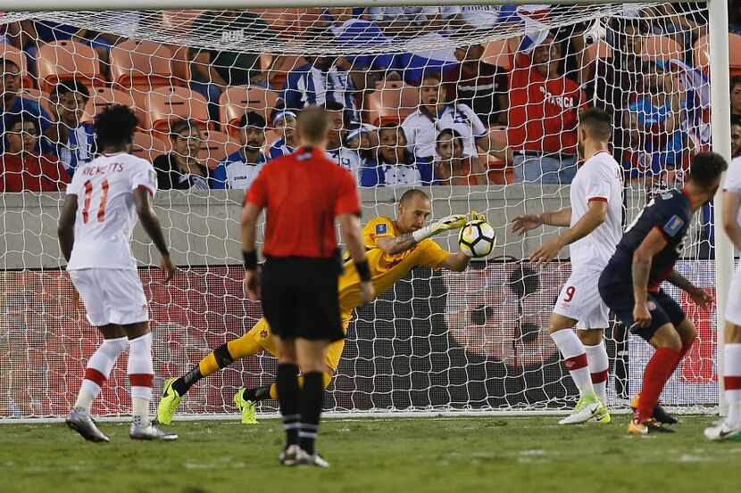 Milan Borjan #18 of Canada makes a save against Costa Rica in the second half at BBVA...