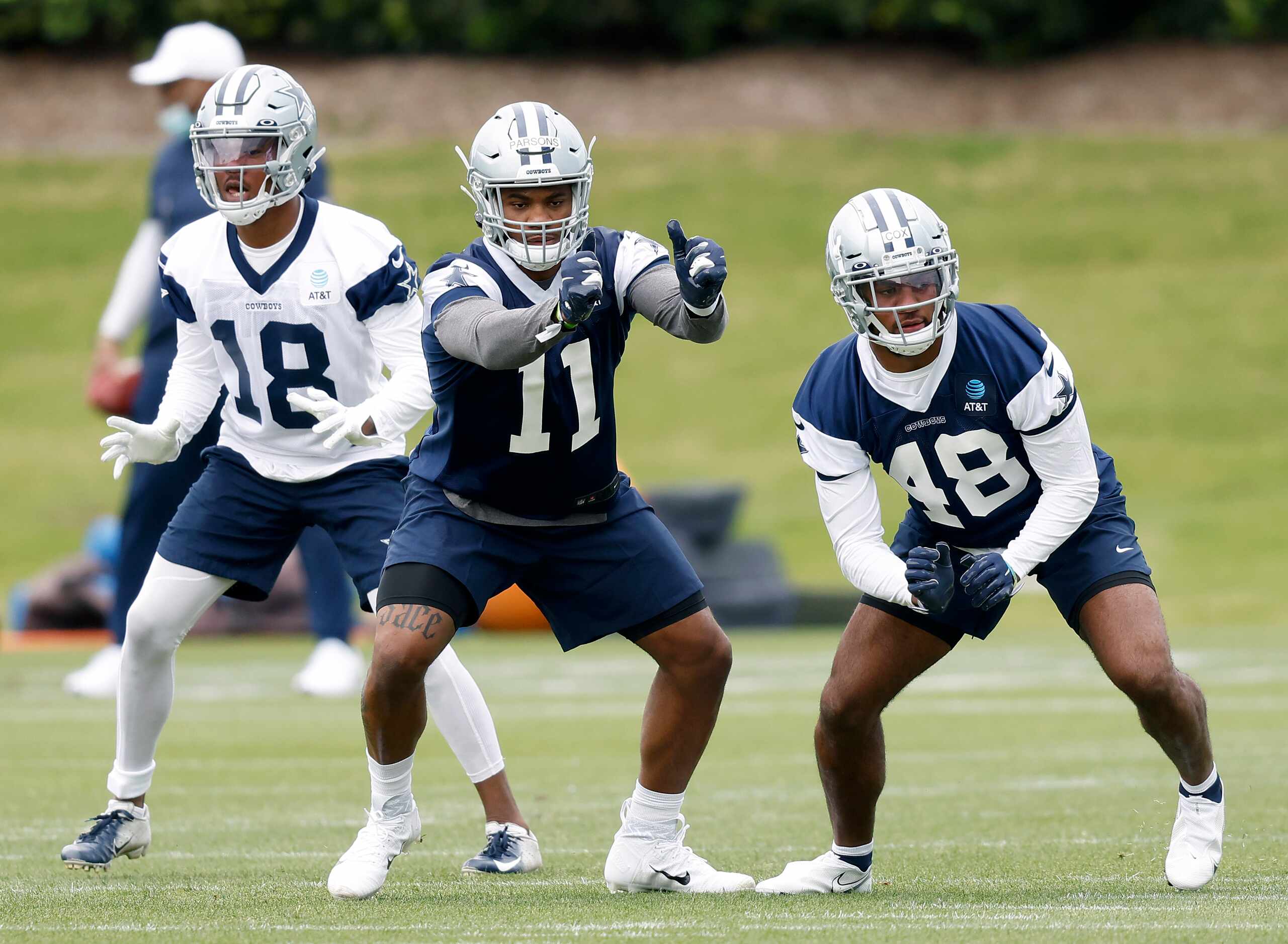 Dallas Cowboys rookie linebackers Micah Parsons (11) and Jabril Cox (48) run through drills...