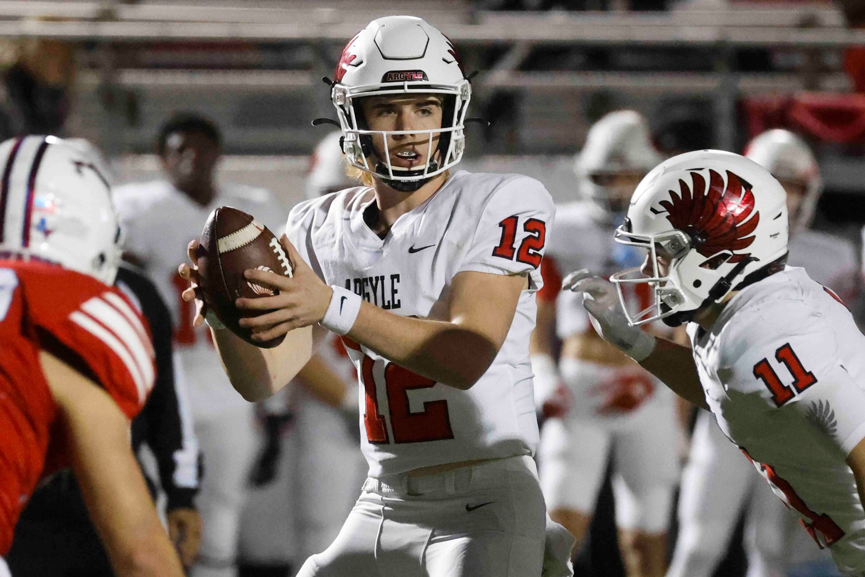 Argyle high’s QB John Gailey (12) plays against Grapevine high during the first half of a...