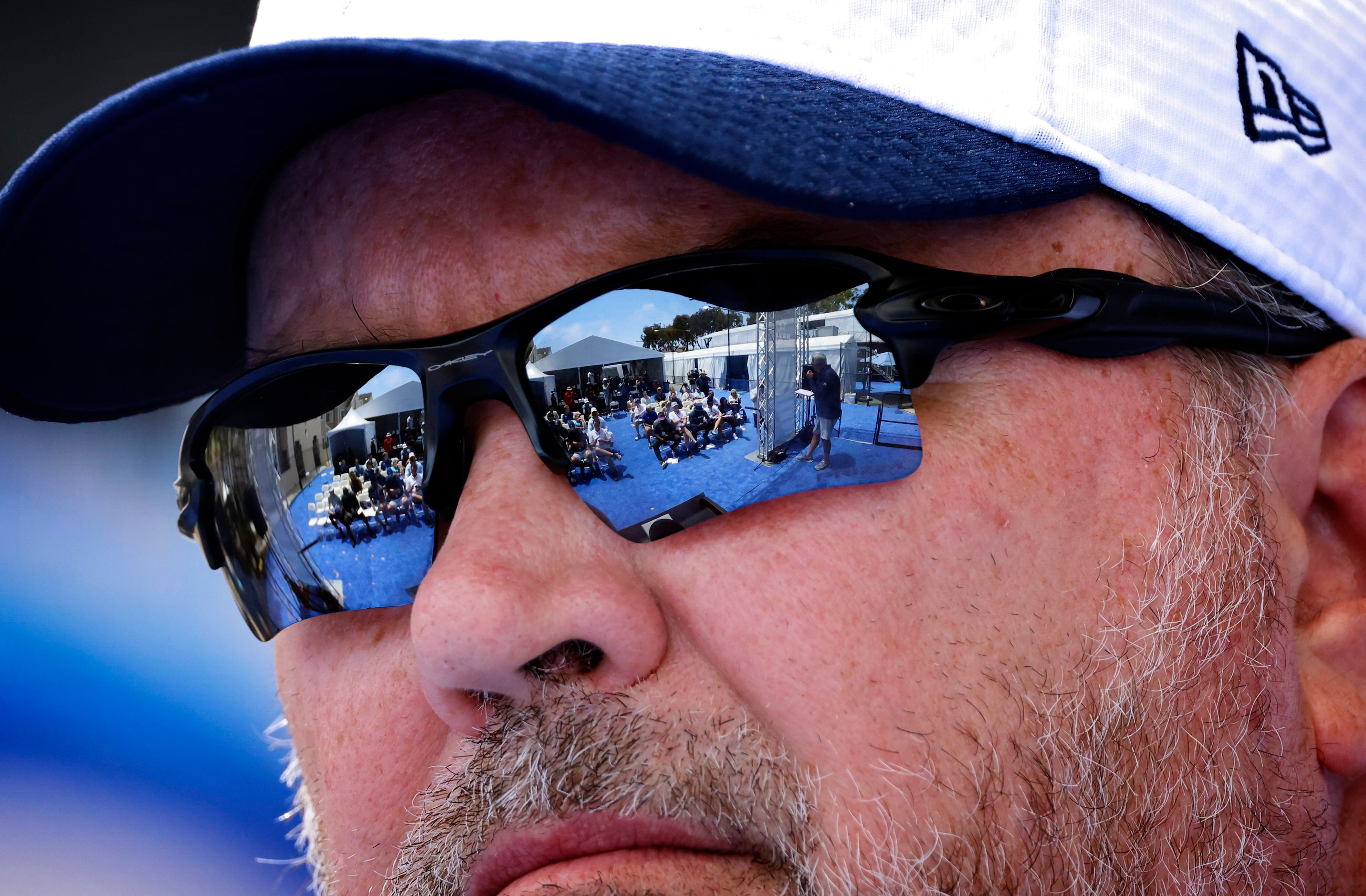 Dallas Cowboys head coach Mike Mccarthy listens to a question from the media (reflected in...