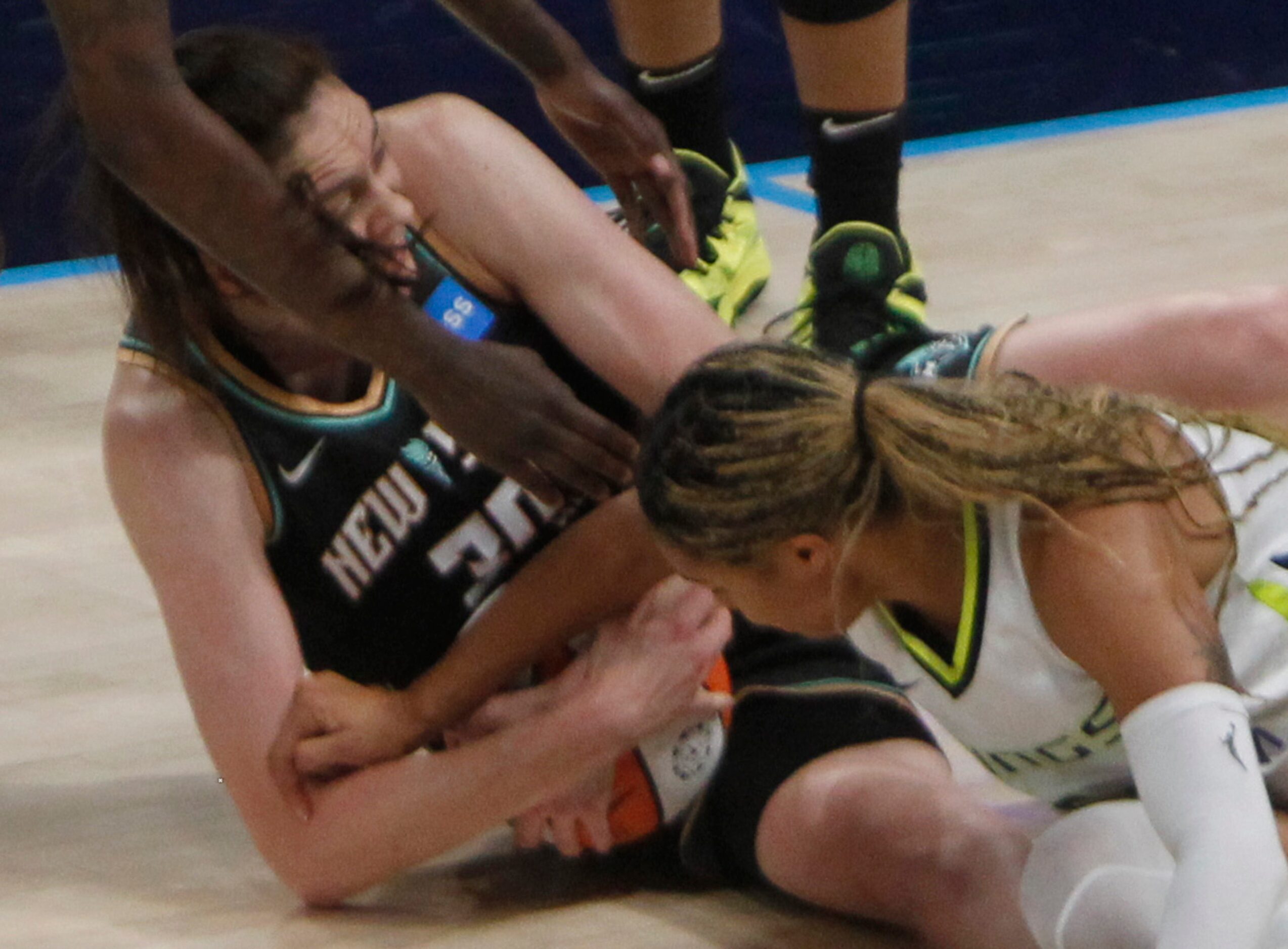 Dallas Wings forward Satou Sabally (0), right, battles New York Liberty forward Breanne...