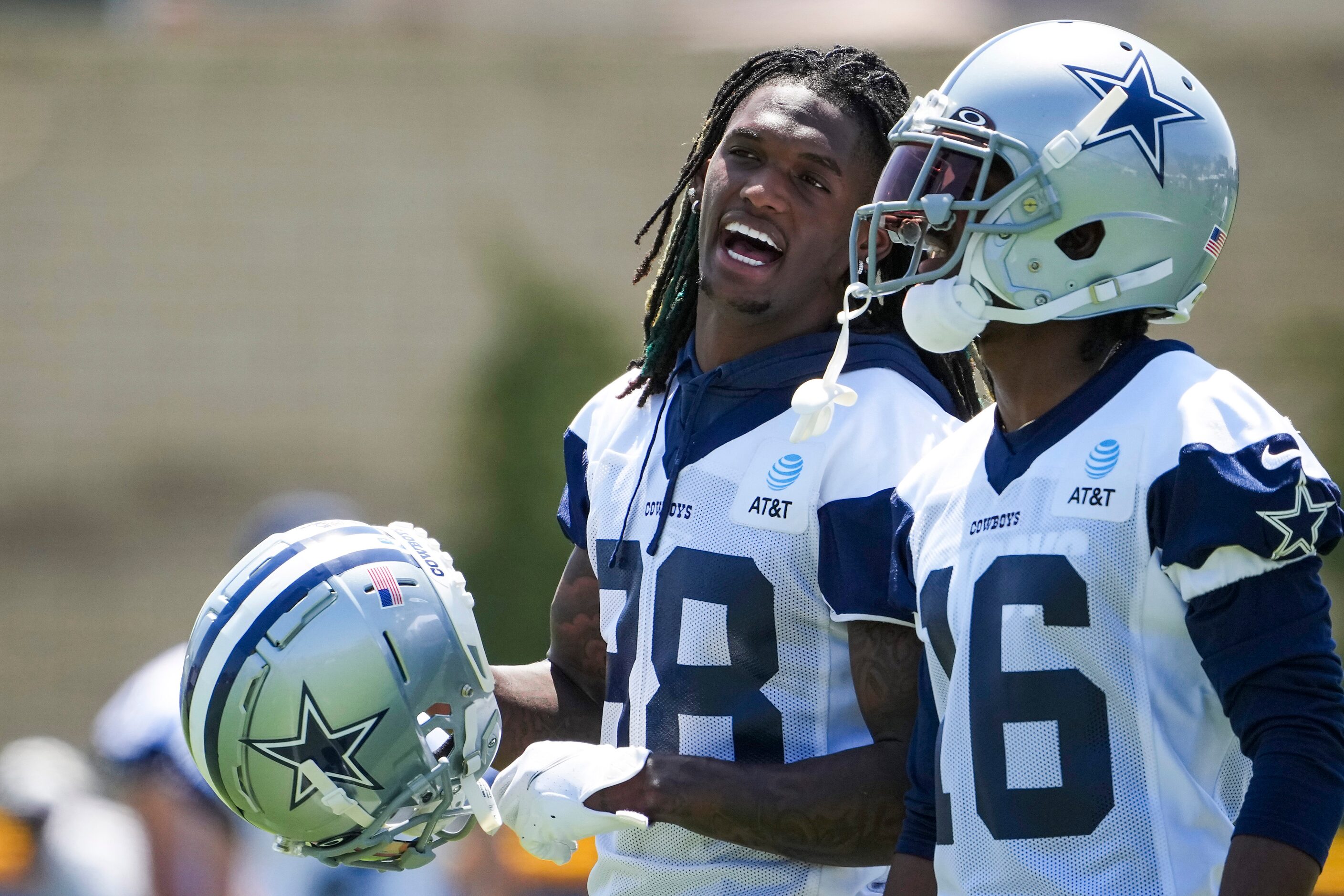 Dallas Cowboys wide receiver CeeDee Lamb (88) talks with wide receiver Reggie Davis (16)...