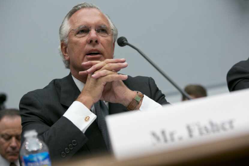 Richard Fisher said the Dodd-Frank law has not ended the risks to the economy.
