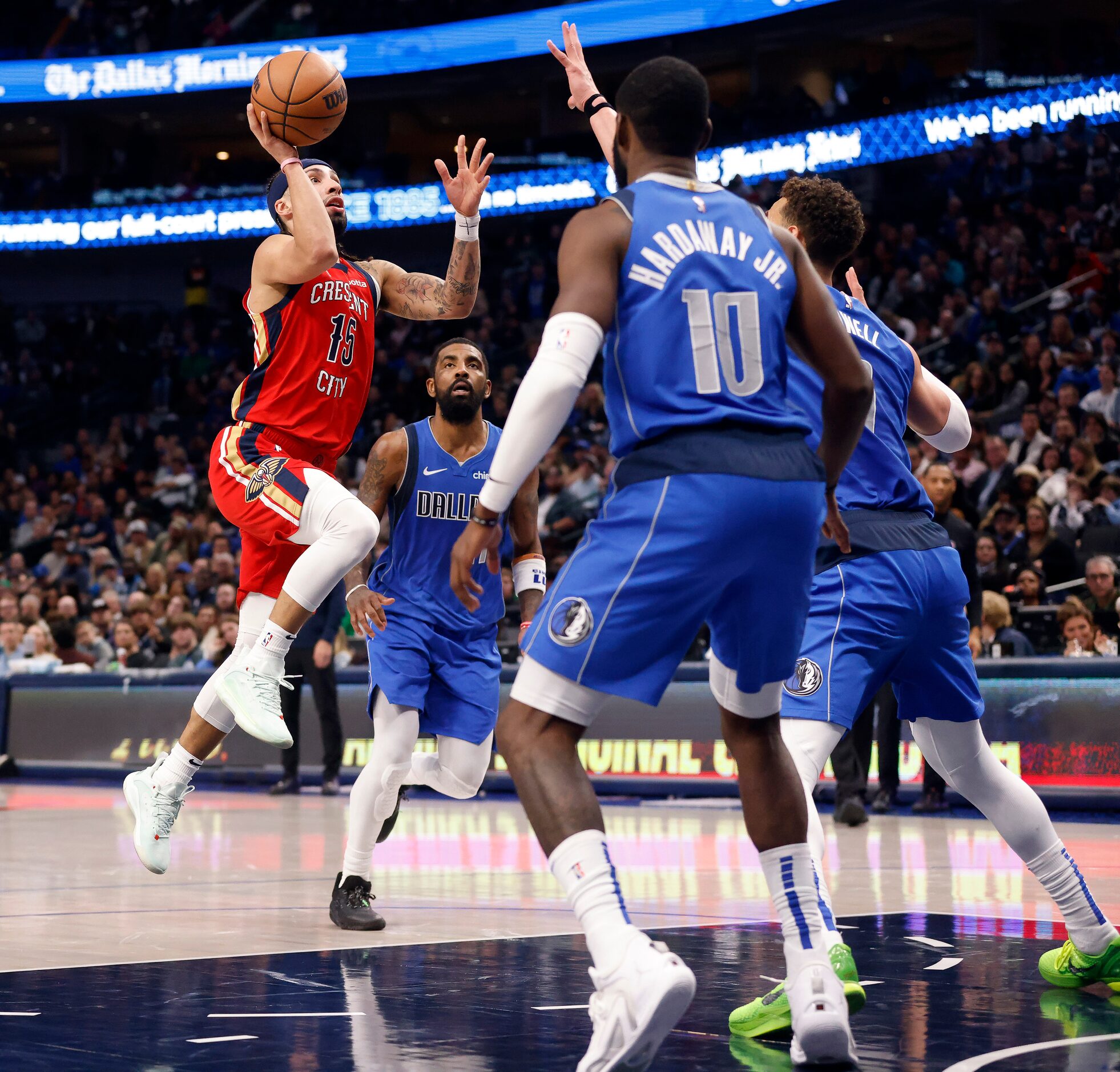 New Orleans Pelicans guard Jose Alvarado (15) drives the lane against Dallas Mavericks guard...