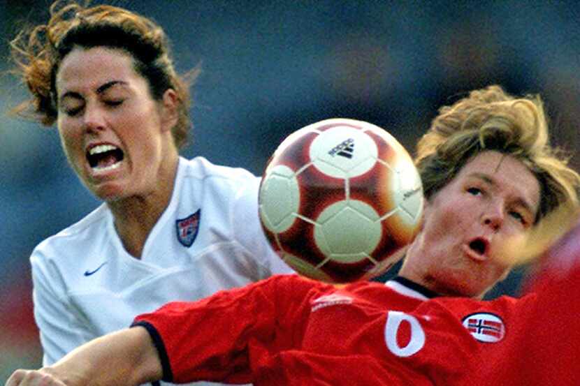  September 14, 2000--USAÂ Â midfielder Julie Foudy (in white) fights for possession with...