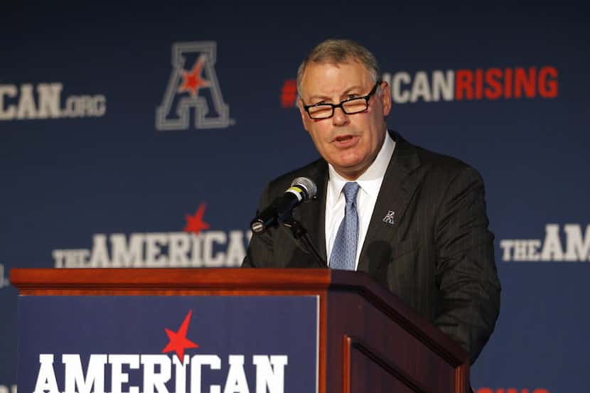 FILE - In this Aug. 4, 2015, file photo, American Athletic Conference Commissioner Mike...