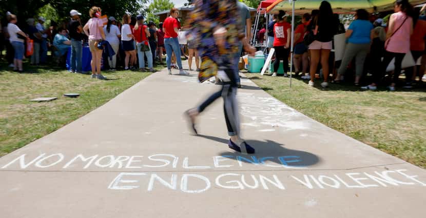 Words written on the path during a rally to support the Allen community and those impacted...