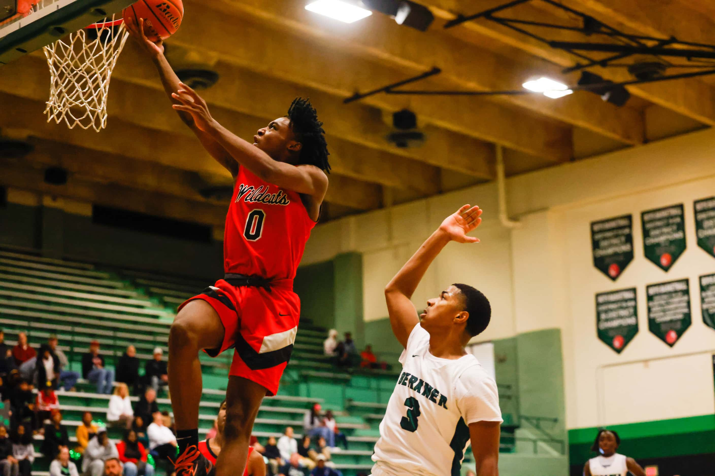 Lake Highlands High School' Jaylen Washington #0 goes for a shot against Berkner High School...