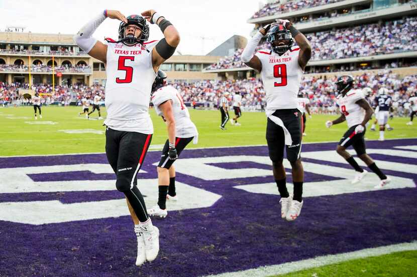 Texas Tech quarterback Patrick Mahomes II (5) and wide receiver Jonathan Giles (9) celebrate...