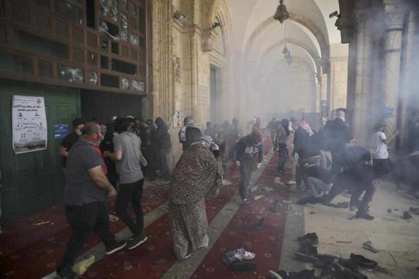 Palestinians clash with Israeli security forces at the Al Aqsa Mosque compound in...