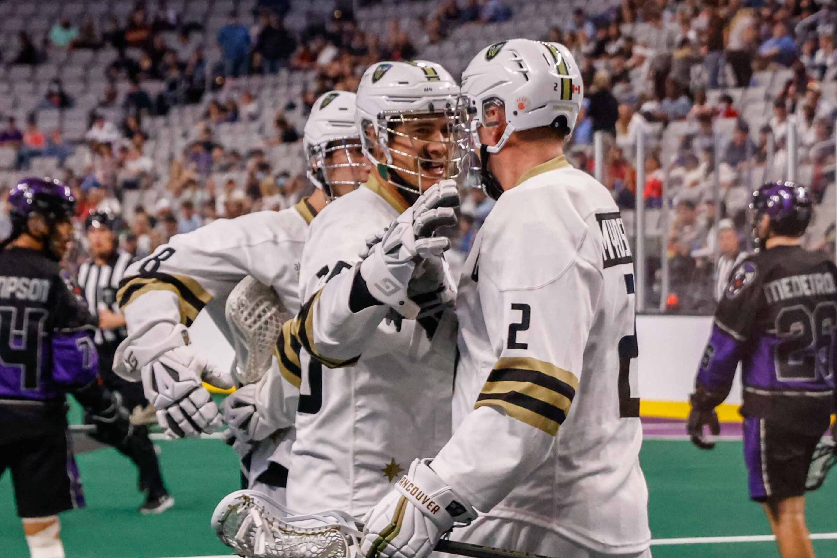 Vancouver Warriors Mitch Jones (16) and Brett Mydske (2) celebrate a goal against the...