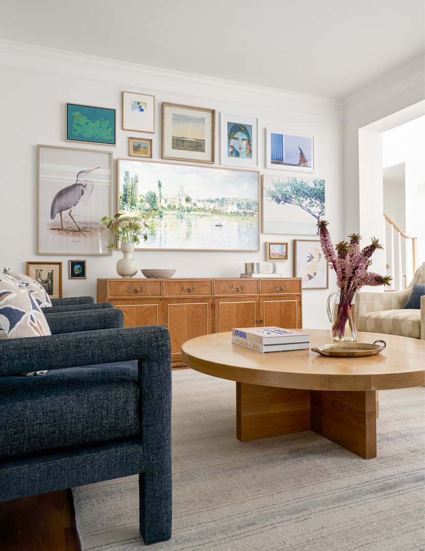 In this living space, designer Janelle Patton designed a gallery wall using the client's art...