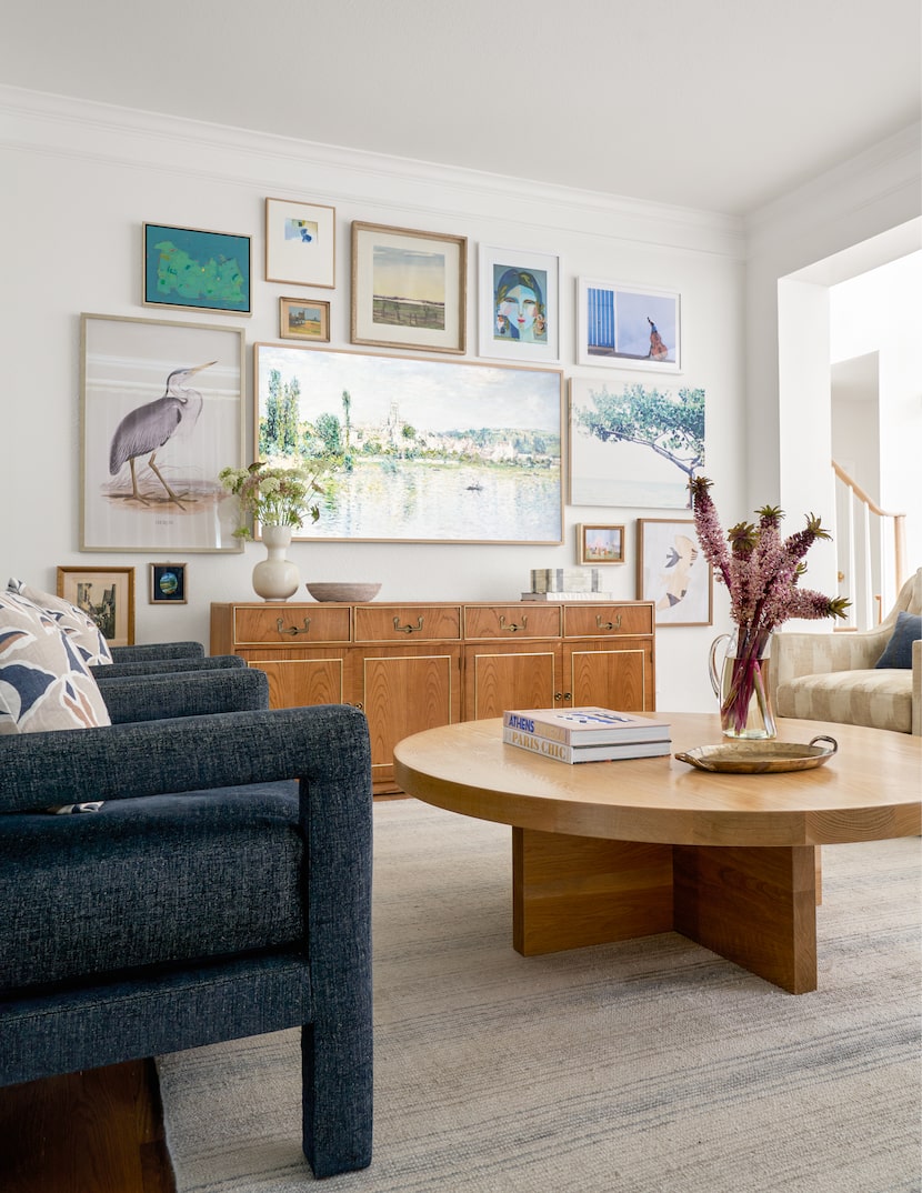 In this living space, designer Janelle Patton designed a gallery wall using the client's art...