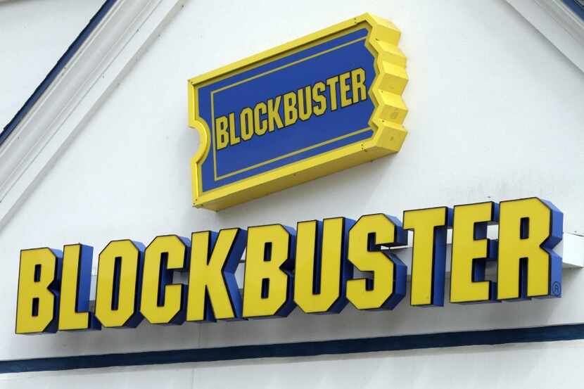 FILE - In this Sept. 22, 2010, file photo, a Blockbuster sign on a store is seen in Barre,...