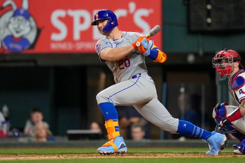 New York Mets' Pete Alonso follows through while hitting an RBI double to score Brandon...