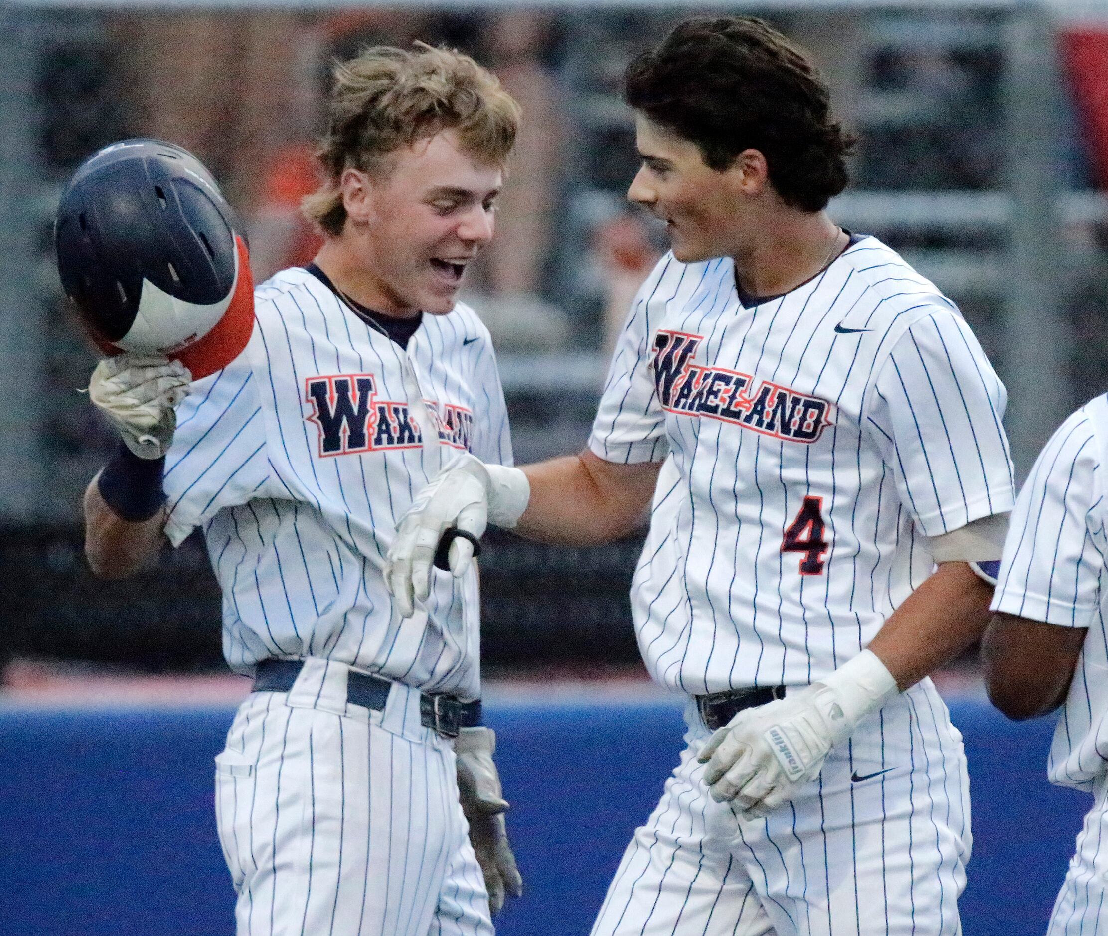 Wakeland shortstop Will Jamison (13) congratulates thord baseman Own Cassano (4) afte...