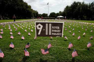 SMU students walk by a display of boots and flags on September 10, 2010 on the SMU campus....