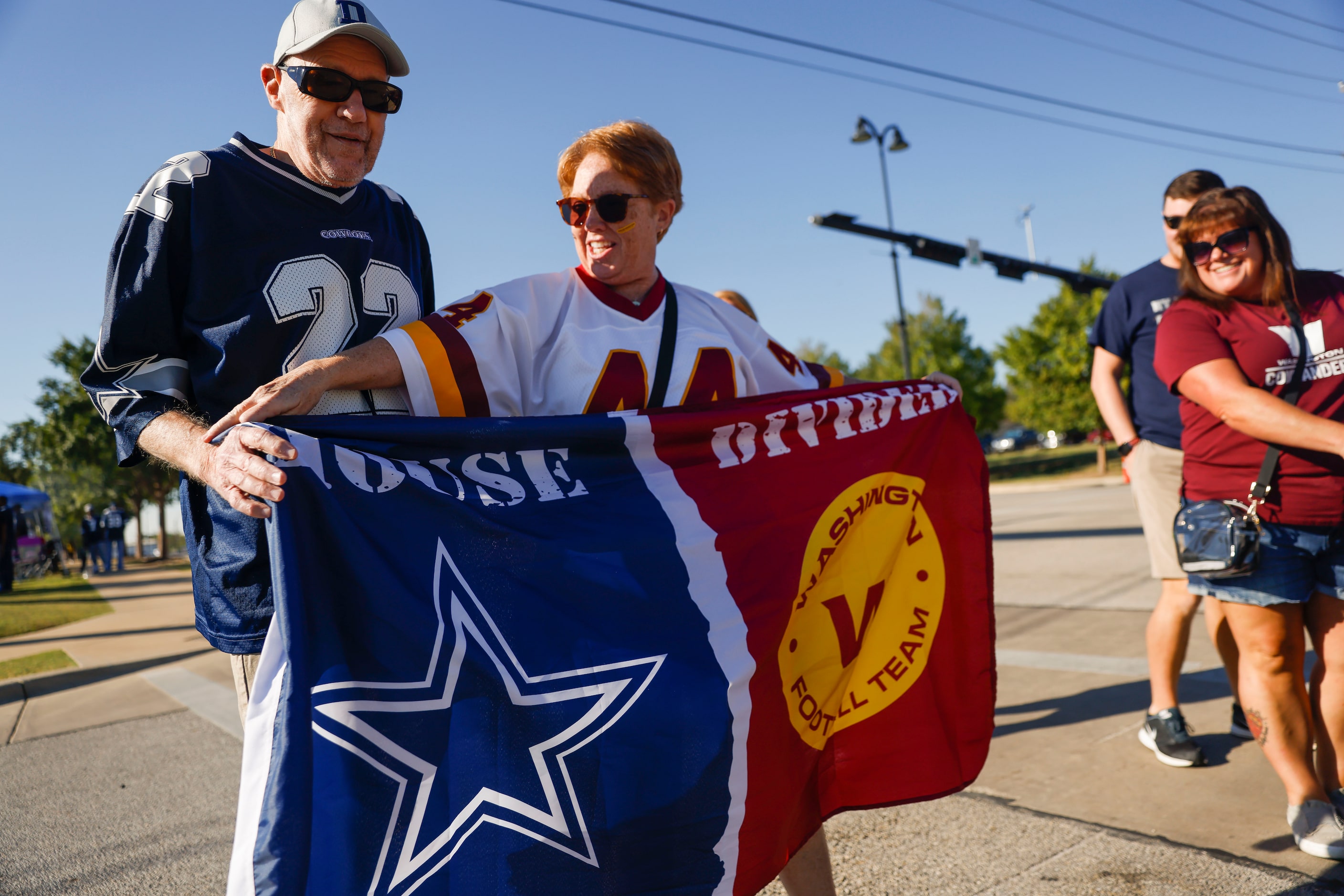 Tim and Stephanie Newman from Laurel Springs, NC Hold a house divided flag before the...