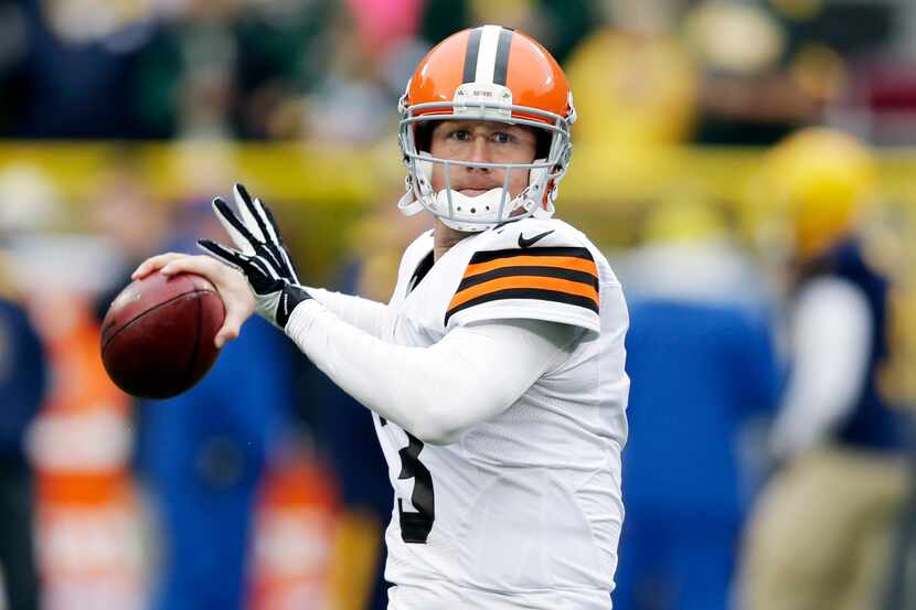 FILE - In this Oct. 20, 2013, file photo, Cleveland Browns' Brandon Weeden warms up before...