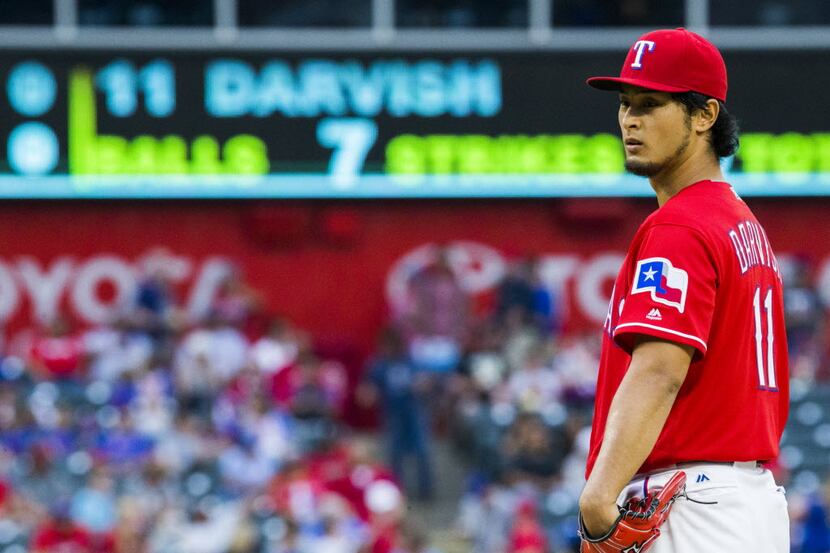 Texas Rangers starting pitcher Yu Darvish (11) stands on the mound during the second inning...