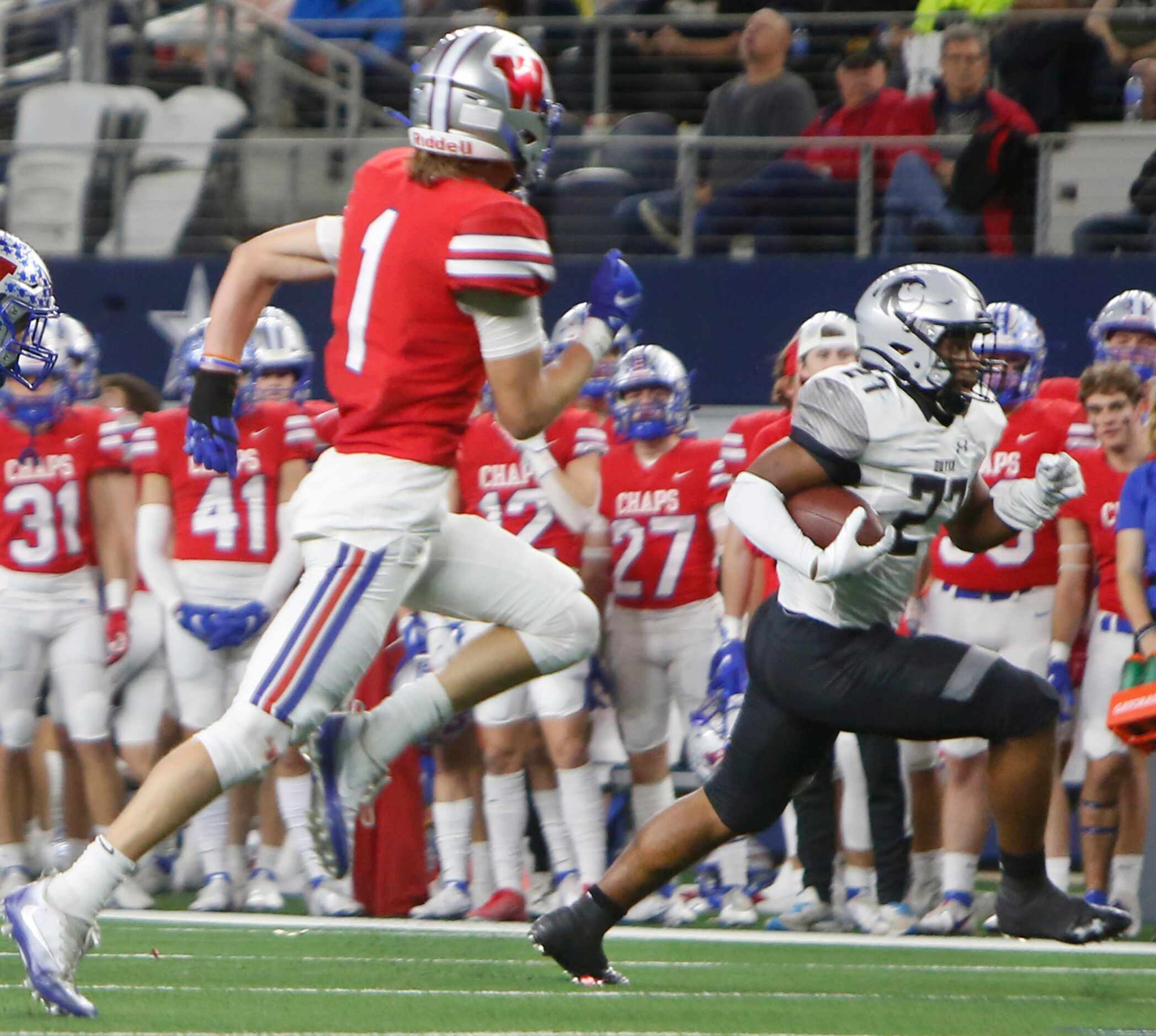 Denton Guyer running back Zane Alvis (27), right, scampers into the Chaparrals secondary as...
