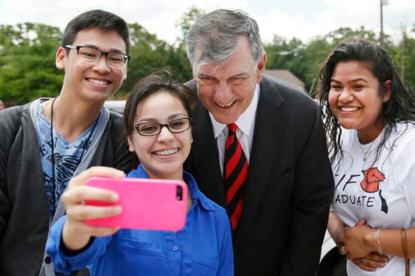 
Lexie Dena grabs a selfie with Mayor Mike Rawlings and fellow interns Phuc Luong (left) and...