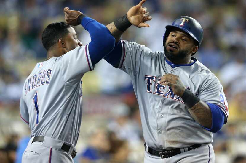 LOS ANGELES, CA - JUNE 17: Prince Fielder #84 of the Texas Rangers is greeted by Elvis...