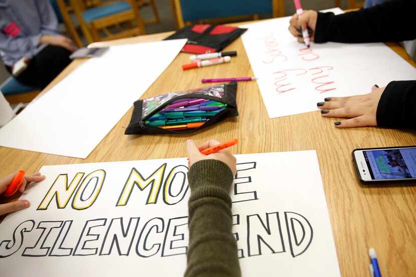 Students made signs for the March for Our Lives rally at Irving High School in Irving,...
