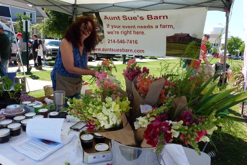 At Coppell Farmers Market, Sue Newhouse and husband Brian O'Dwyer sell berry plants, jams,...