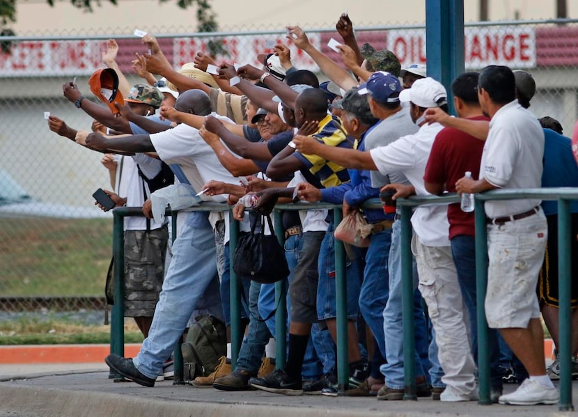 
At the Garland Day Labor Center, workers vie for the attention of contractors. The center...