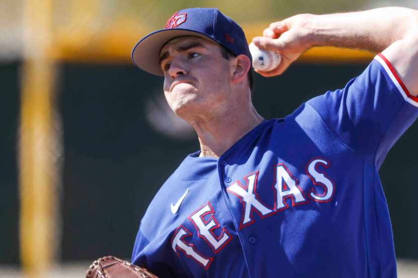 Texas Rangers pitcher Cody Bradford throws a pitch for batting practice during a spring...