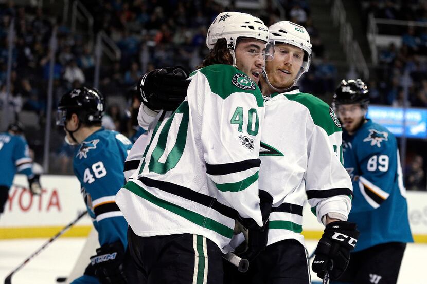 Dallas Stars' Remi Elie (40) celebrates with Cody Eakin after scoring a goal against the San...