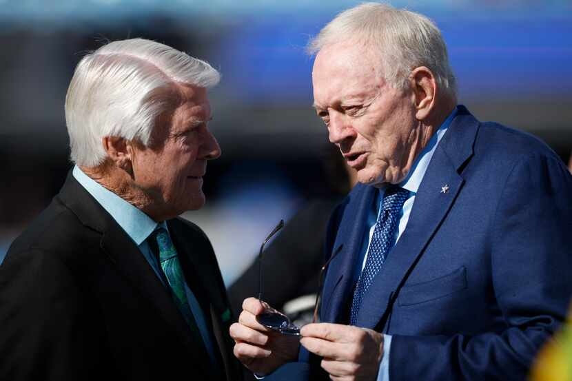 Pro Football Hall of Fame coach Jimmy Johnson chats with Cowboys owner Jerry Jones during...