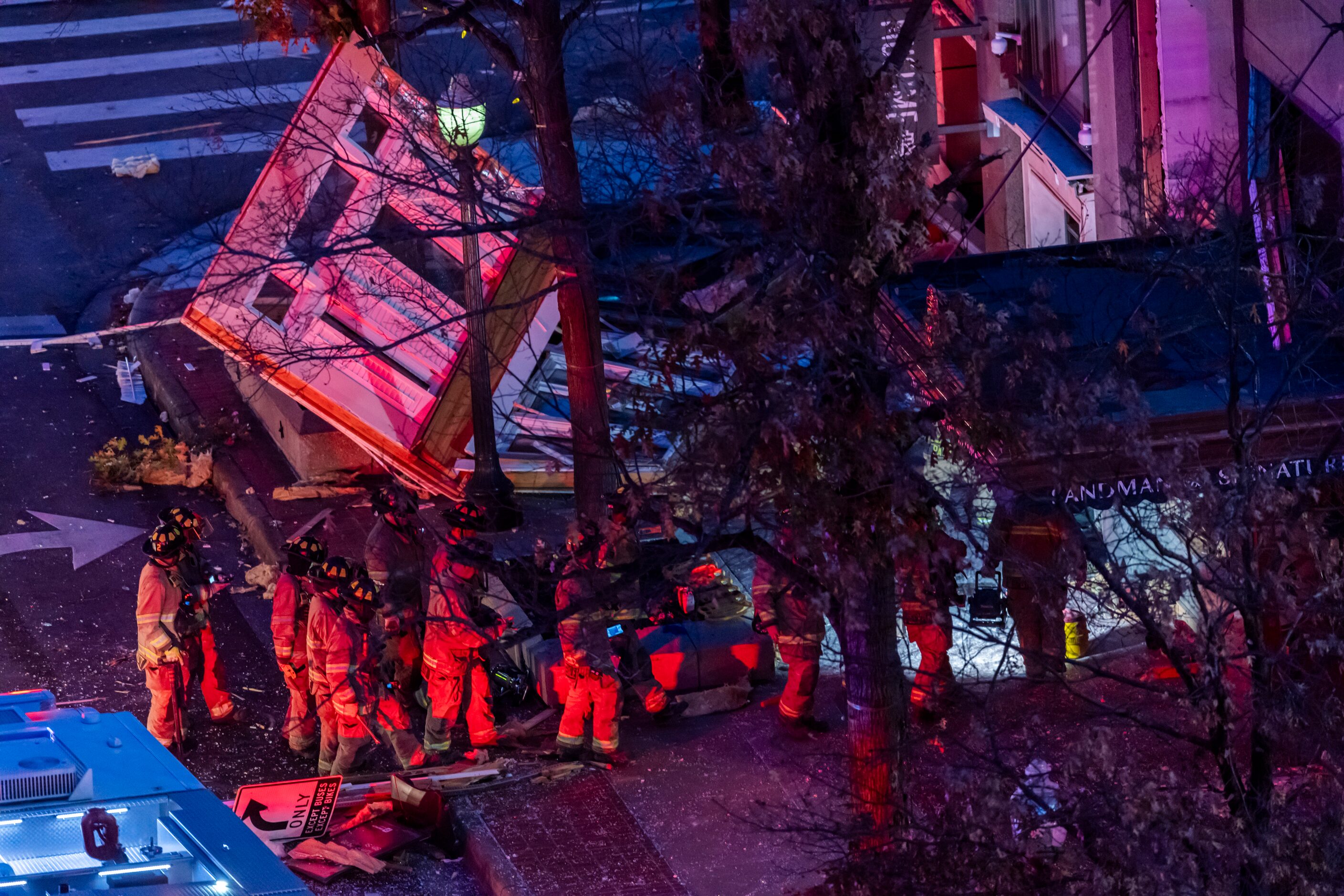 Fort Worth firefighters enter the Sandman Signature Hotel after at least 21 people were...