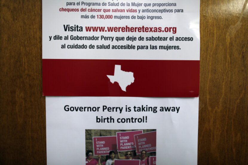 A signed taped to a door for patients to see at the Planned Parenthood clinic in Plano...