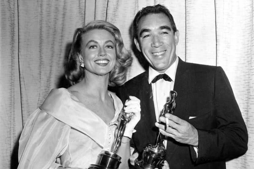 File-This March 27, 1957, file photo shows Best supporting Oscar winners Dorothy Malone and...